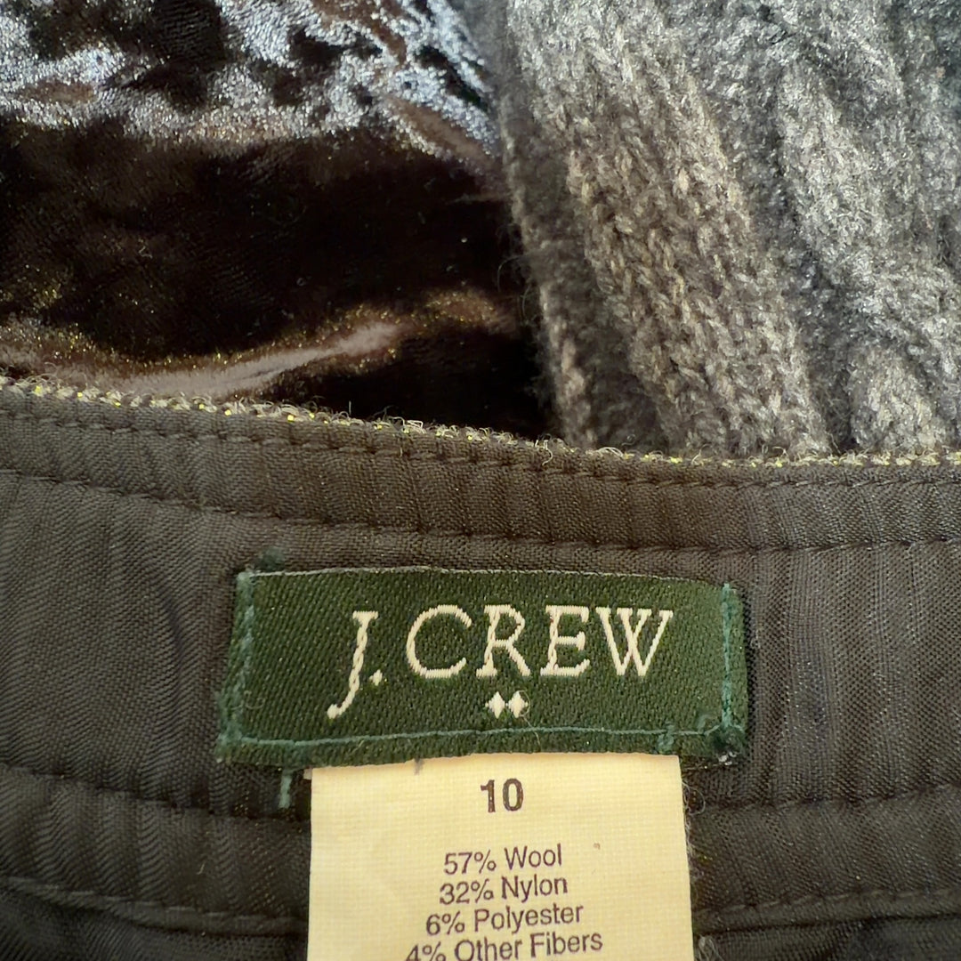 Olive green pleated A-line skirt, back view showing elegant drape and fit