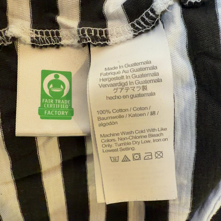 Tag view of black and white striped long sleeve cotton top showing relaxed fit and horizontal stripe pattern