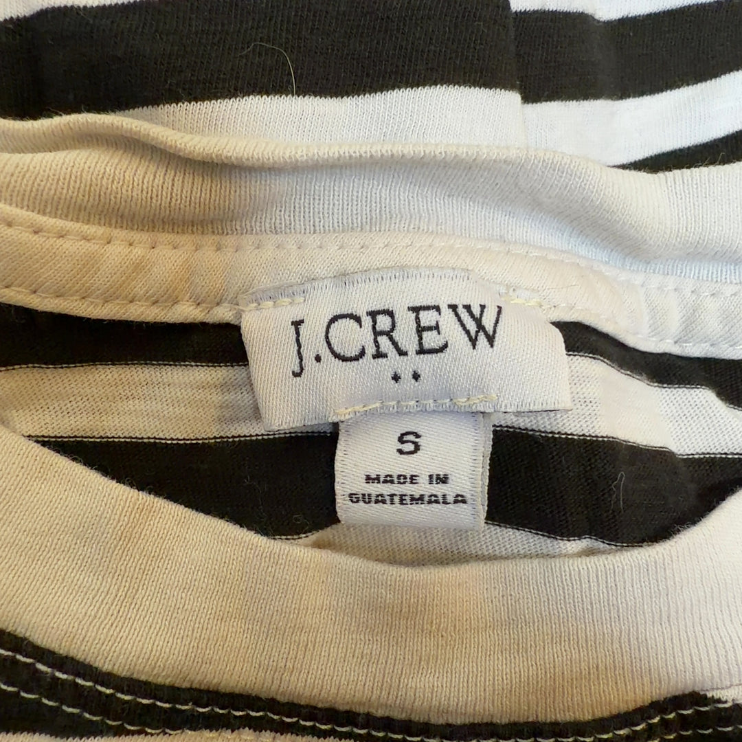 Tag view of black and white striped long sleeve cotton top showing relaxed fit and horizontal stripe pattern