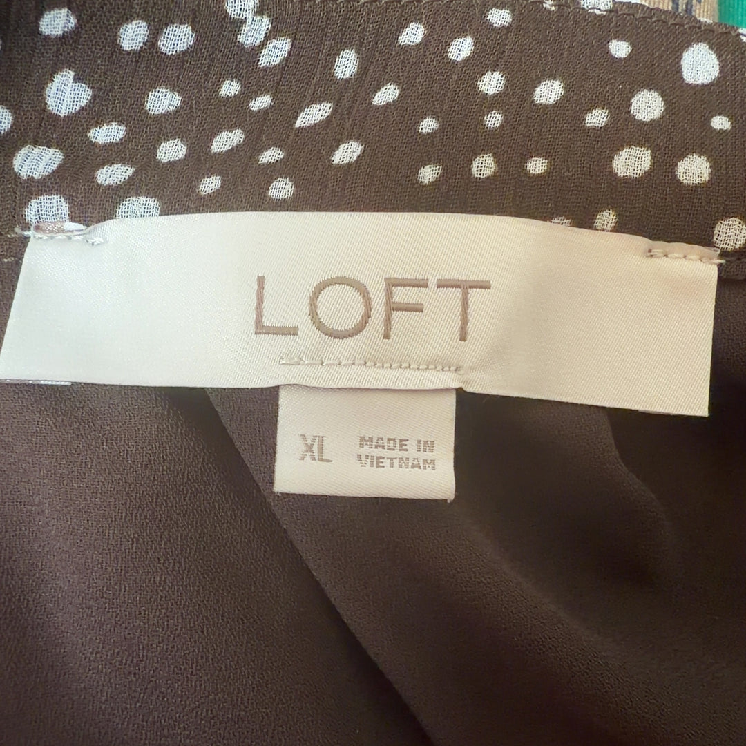 Brown polka dot LOFT top with V-neckline and cap sleeves, back view on model