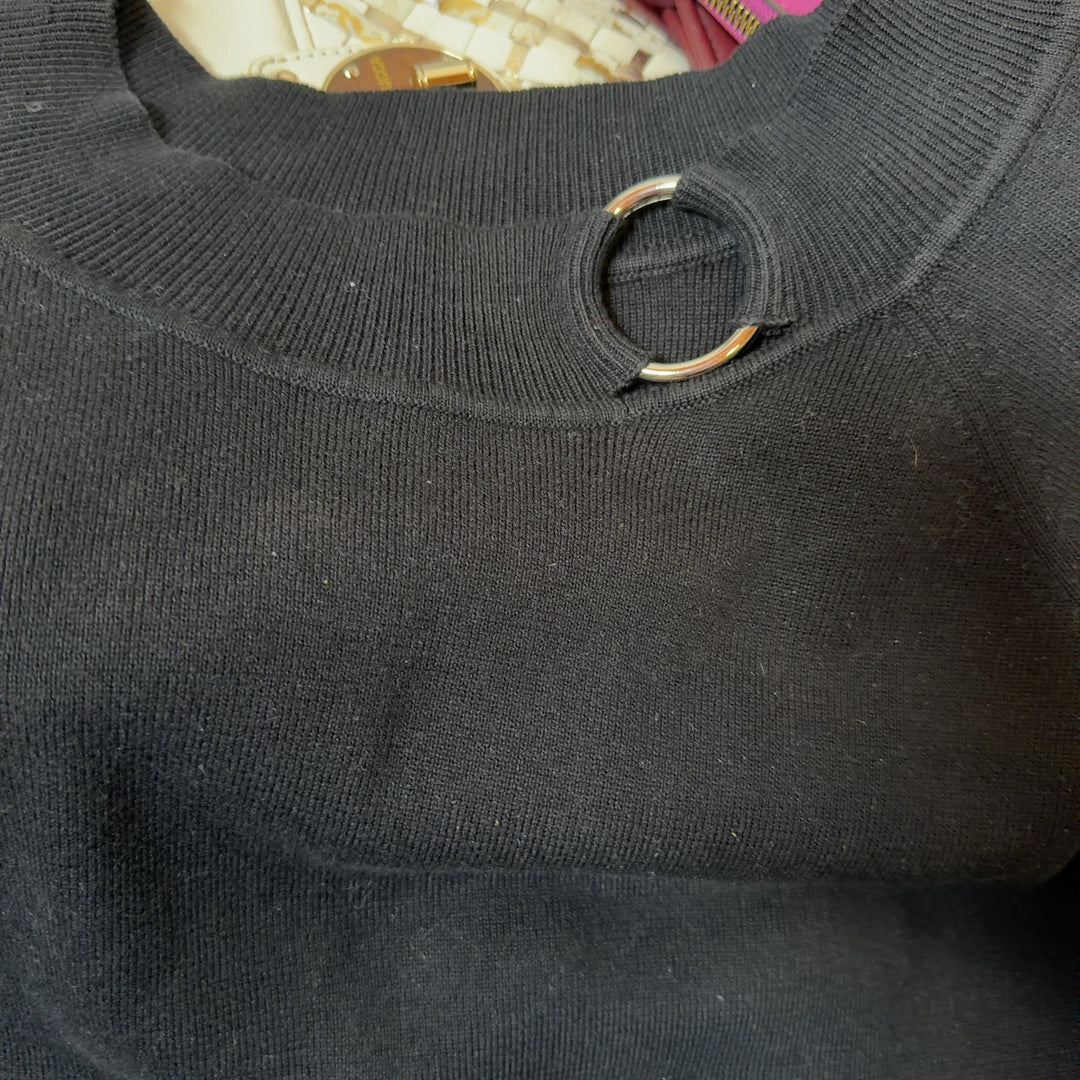 Black cotton top with keyhole neckline detail and 3/4 sleeves, back view