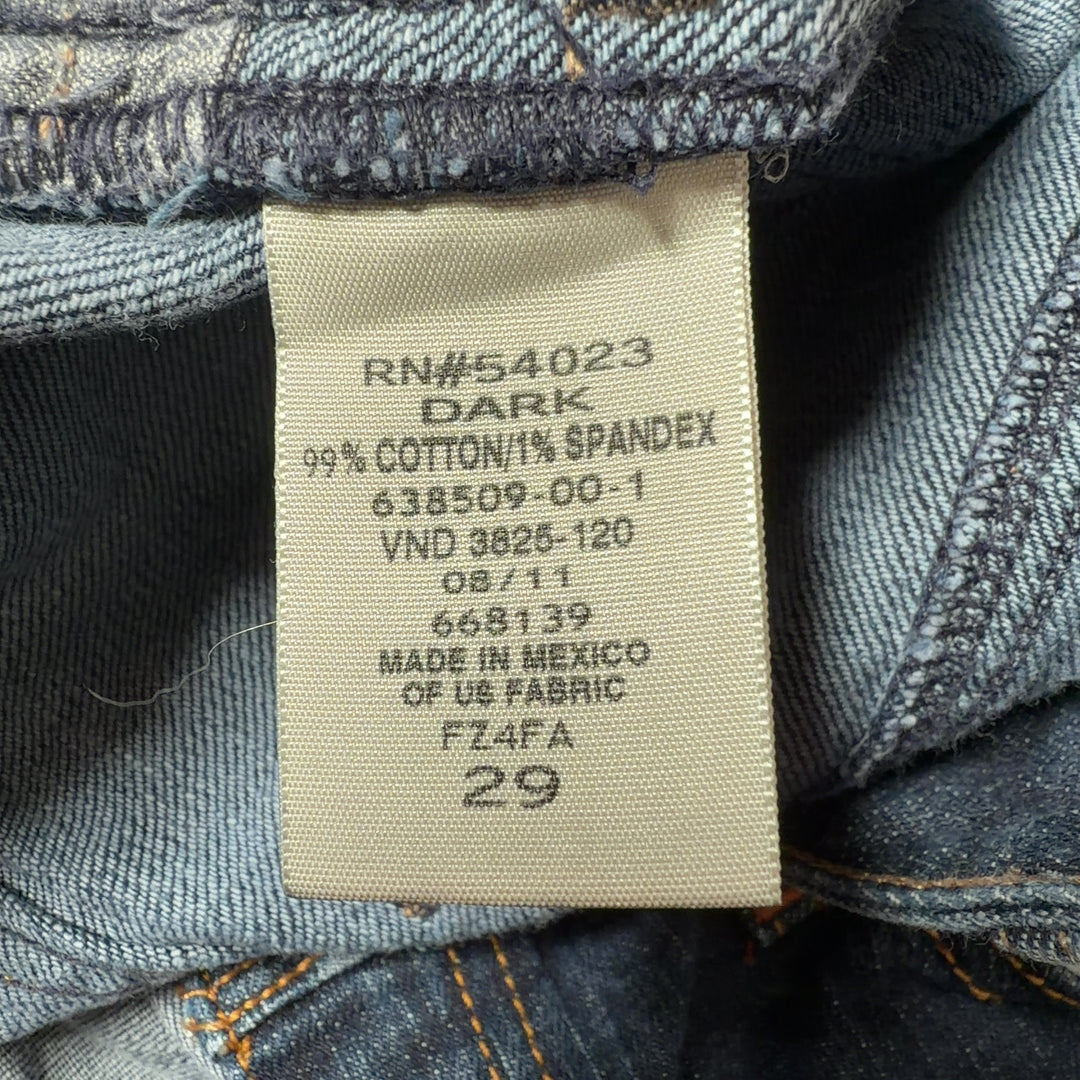 Dark blue denim knee-length skirt back view, showing classic denim construction and fit