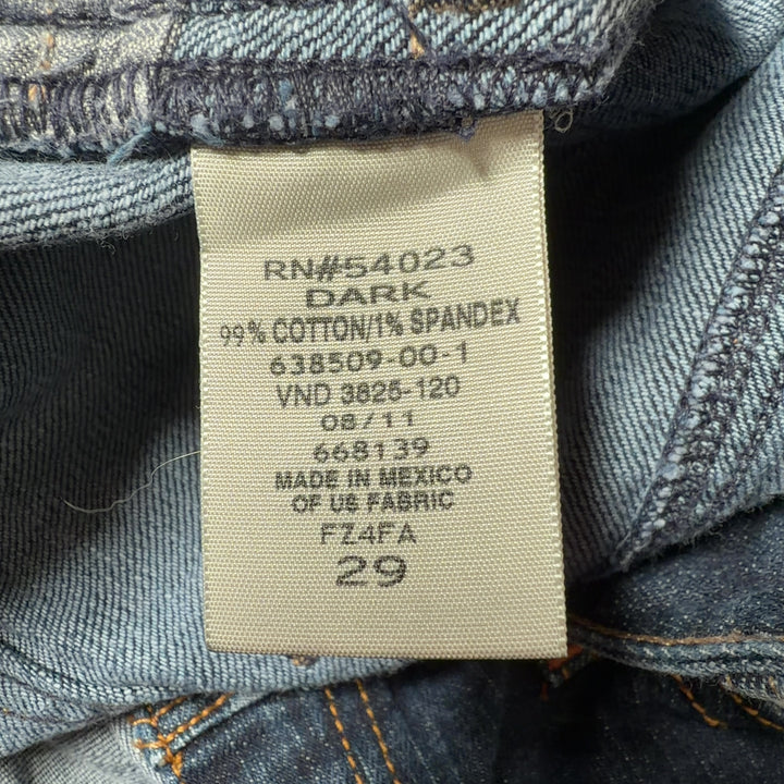Dark blue denim knee-length skirt back view, showing classic denim construction and fit