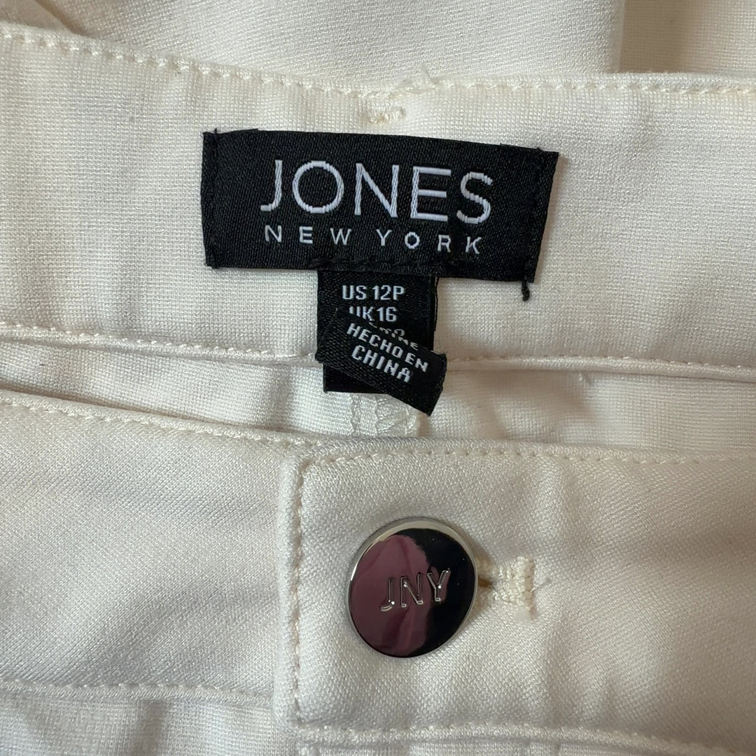 Tag view of cream dress pants showing classic tailoring and comfortable stretch fit