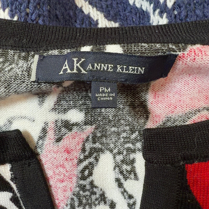 Anne Klein red floral print top with three-quarter sleeves, back view on model