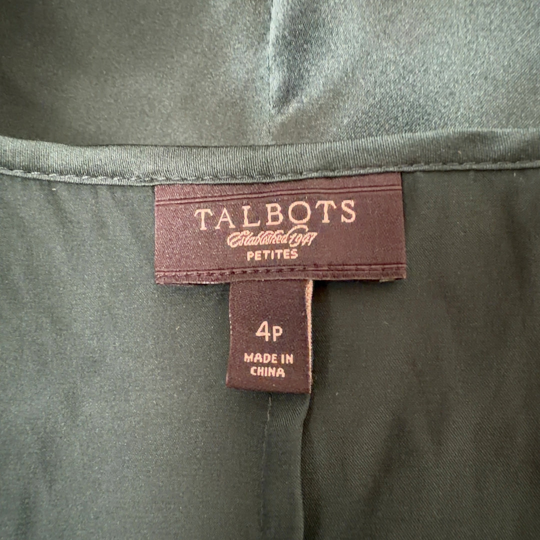 Tag view of green silk ruffle tank top by Talbots showing ruffle detailing and sleeveless cut
