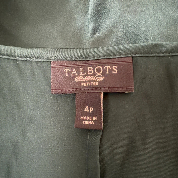 Tag view of green silk ruffle tank top by Talbots showing ruffle detailing and sleeveless cut