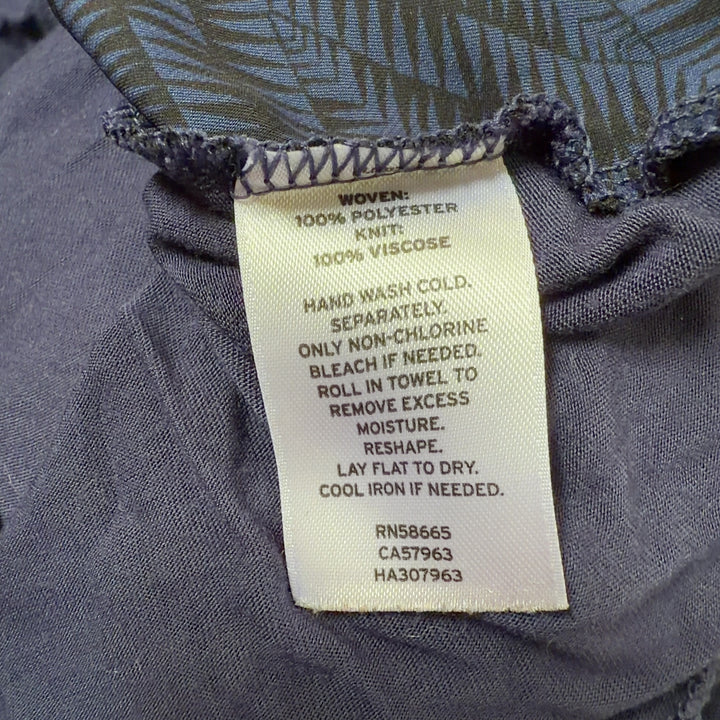 Navy cowl neck sleeveless top back view, showing draped neckline and relaxed fit