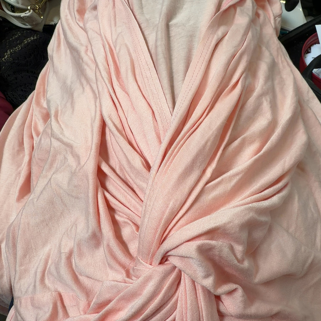 Pink twisted front top with ruched detailing, back view showing knot detail