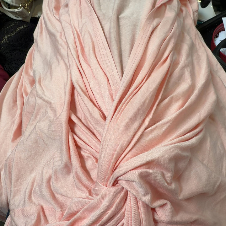 Pink twisted front top with ruched detailing, back view showing knot detail