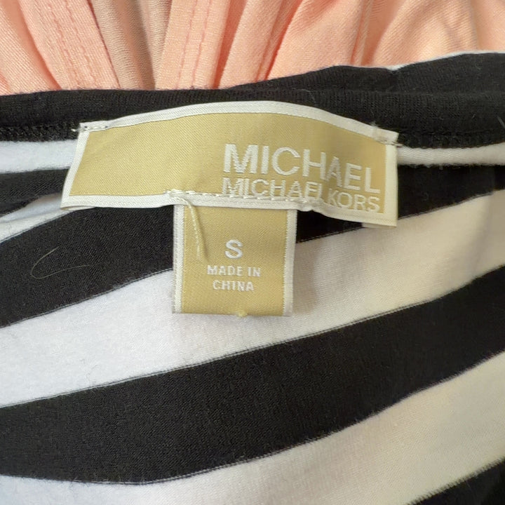 Black and white striped Michael Kors top back view showing fitted silhouette and gold side zip detail
