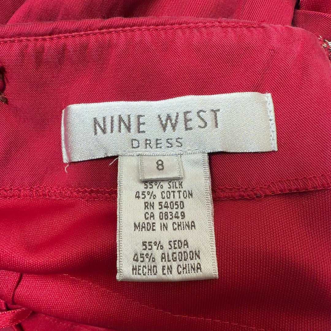 Red ruched midi cocktail dress with spaghetti straps, back view