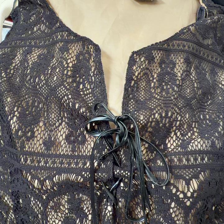 Black lace long sleeve top with tie closure detail, back view