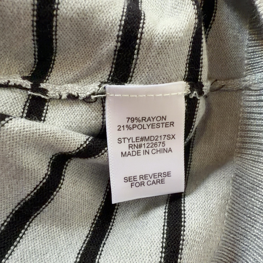 Tag view of gray and navy striped long sleeve knit dress showing curved seaming and relaxed silhouette