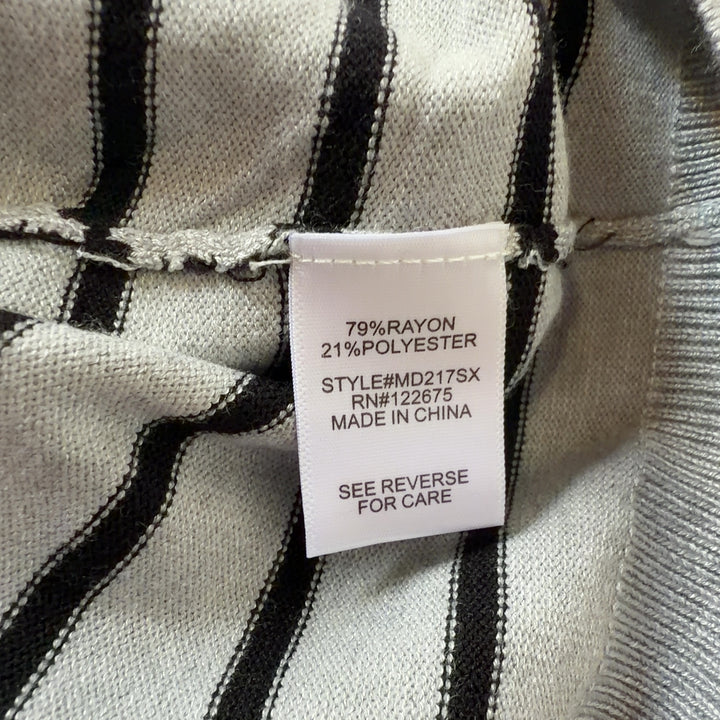 Tag view of gray and navy striped long sleeve knit dress showing curved seaming and relaxed silhouette
