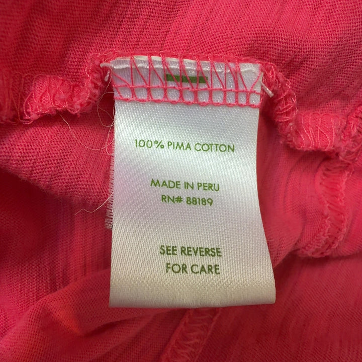Tag view of pink Pima cotton knit dress showing relaxed fit and knee-length cut
