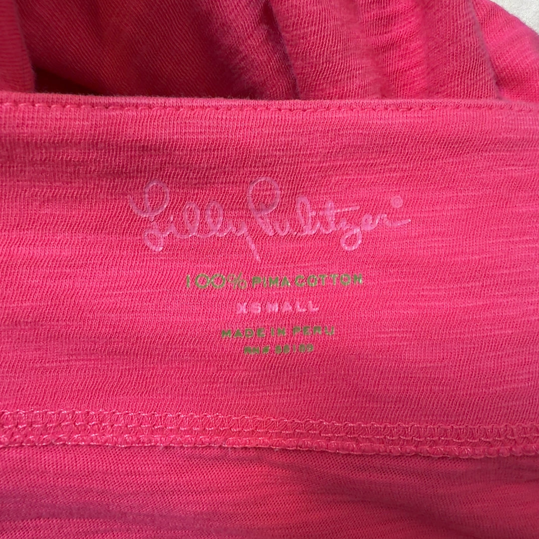 Tag view of pink Pima cotton knit dress showing relaxed fit and knee-length cut