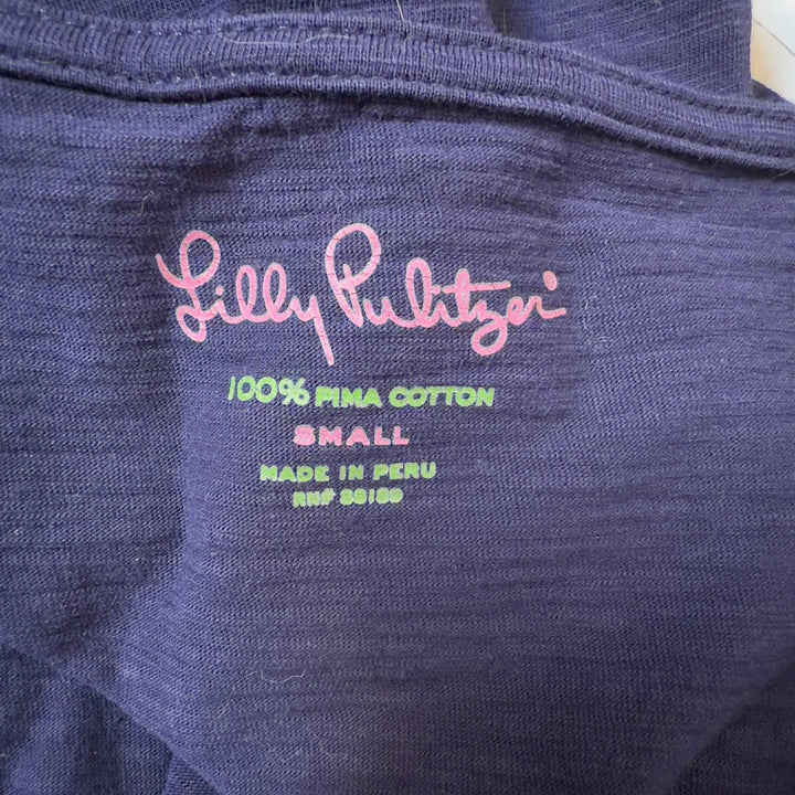 Navy Pima cotton ruffle sleeve dress by Lilly Pulitzer, back view on model