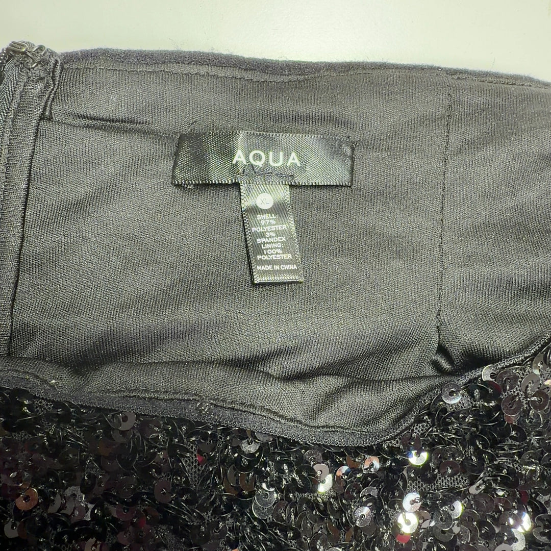 Black sequin midi skirt back view, showing full sequin coverage and elegant silhouette