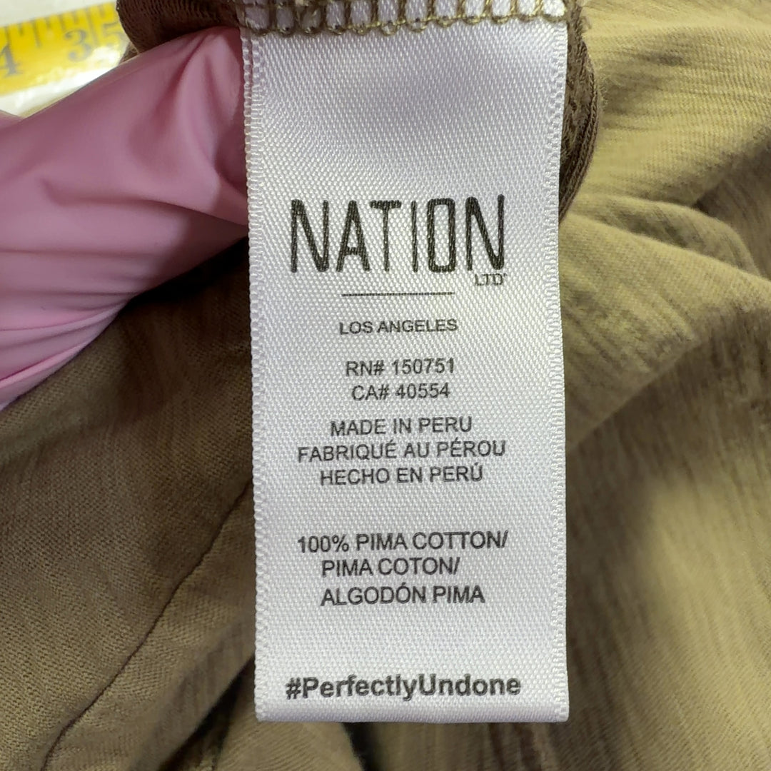 Beige Pima cotton sleeveless tank dress with A-line silhouette, back view