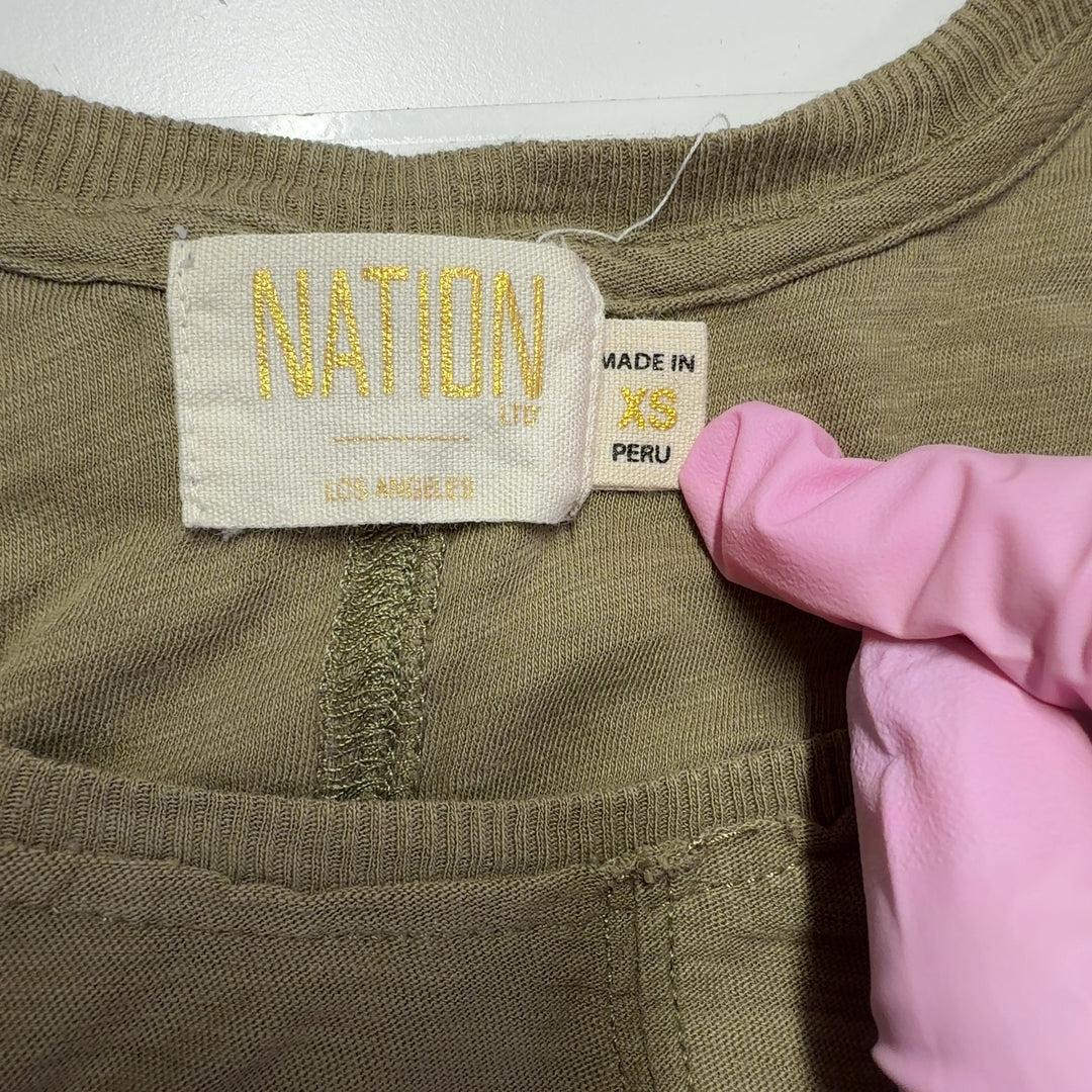 Beige Pima cotton sleeveless tank dress with A-line silhouette, back view