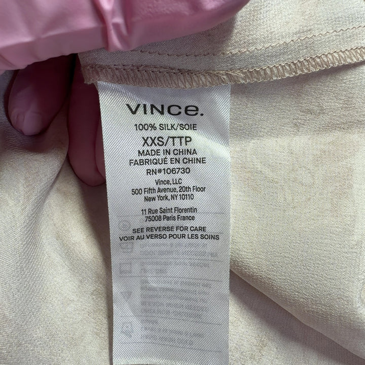 Blush floral silk button-up shirt by Vince, back view displaying full-length sleeves and relaxed fit silhouette