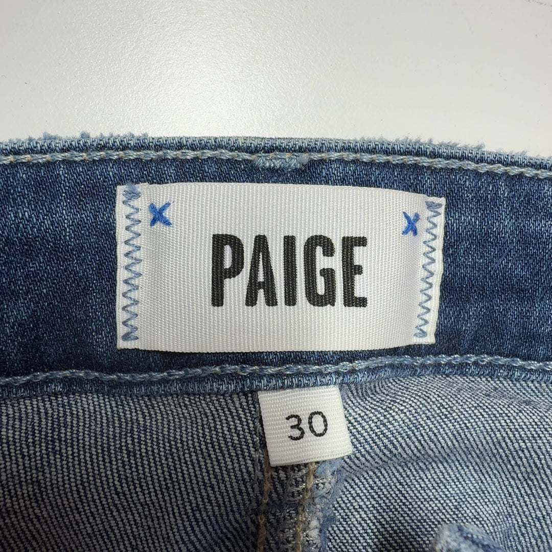 Tag view of Paige blue flare jeans highlighting the high-waisted silhouette and flattering fit on size L
