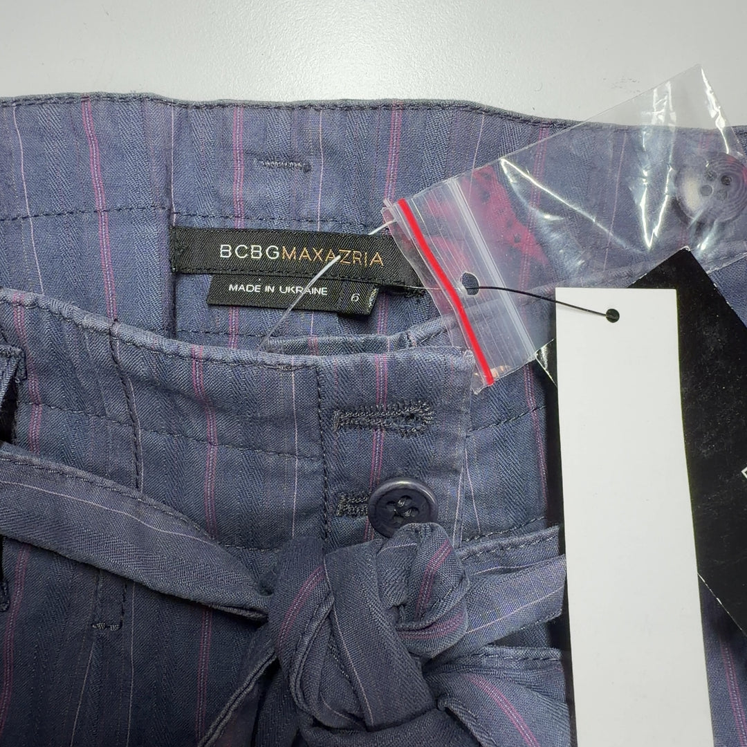 Gray pinstriped cropped shorts with tie-waist detail, back view on model