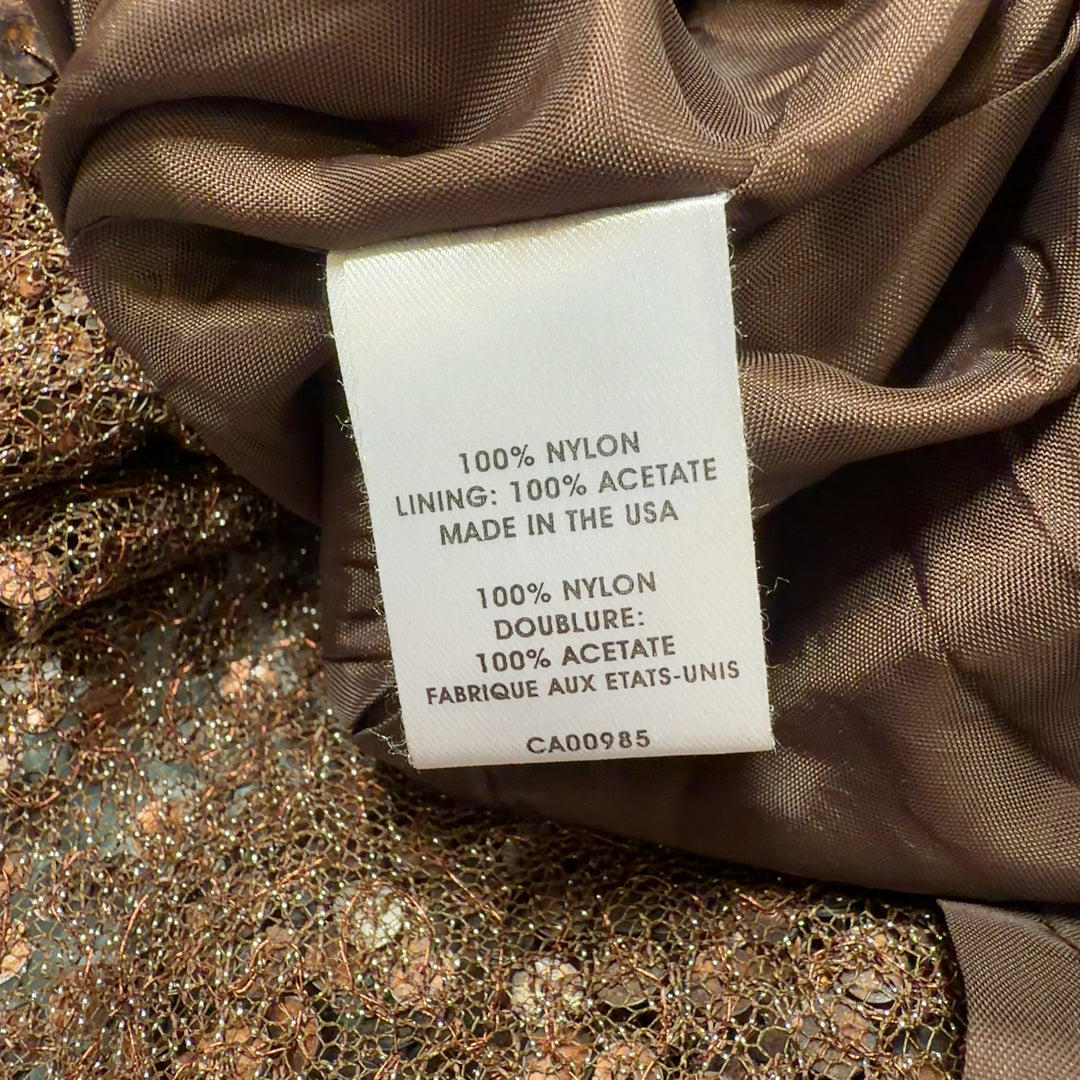 Gold sequin halter cocktail dress with jeweled straps and asymmetrical handkerchief hem, back view