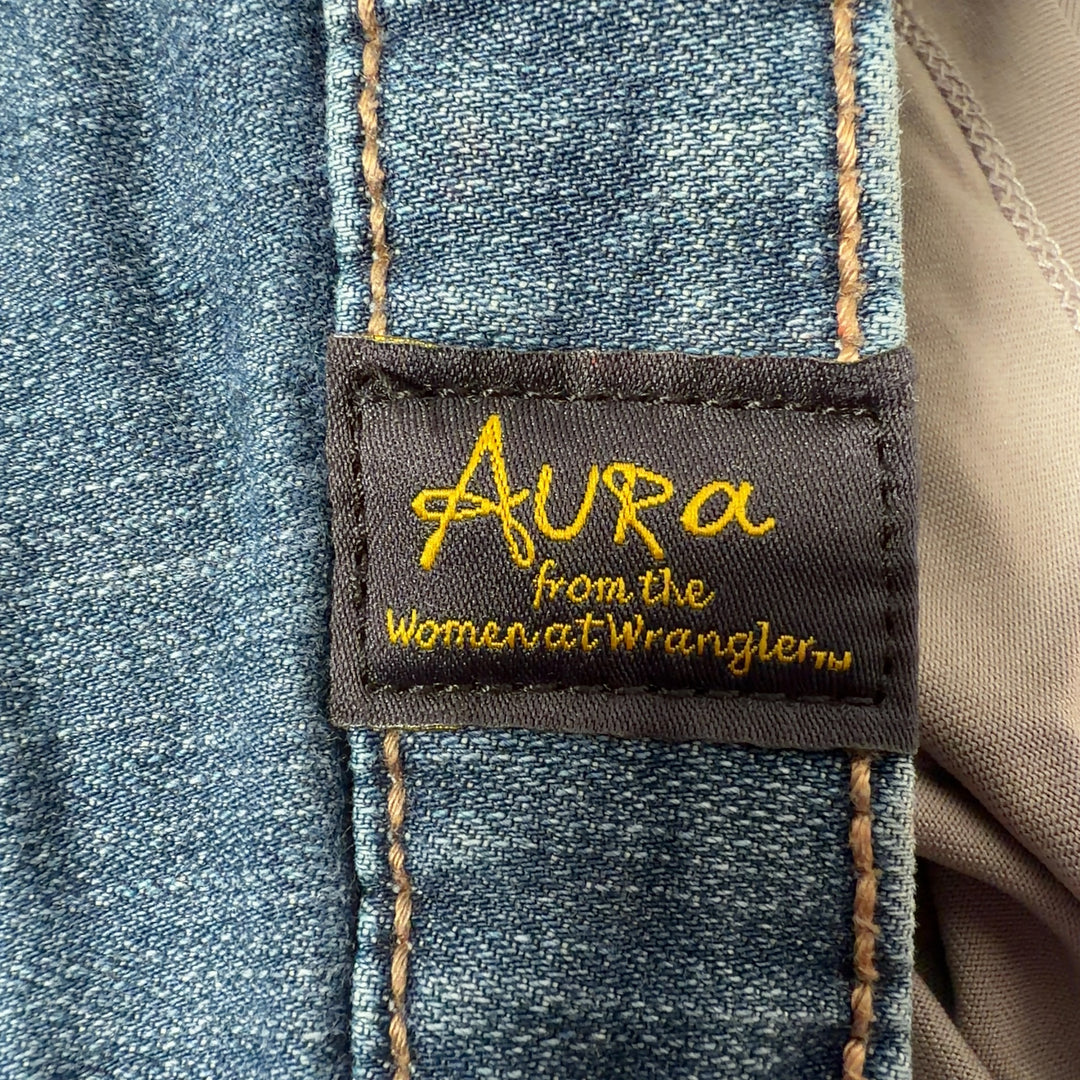 Tag view of blue denim flare jeans by Aura at Wrangler, size XL, showing flared leg design and classic denim construction