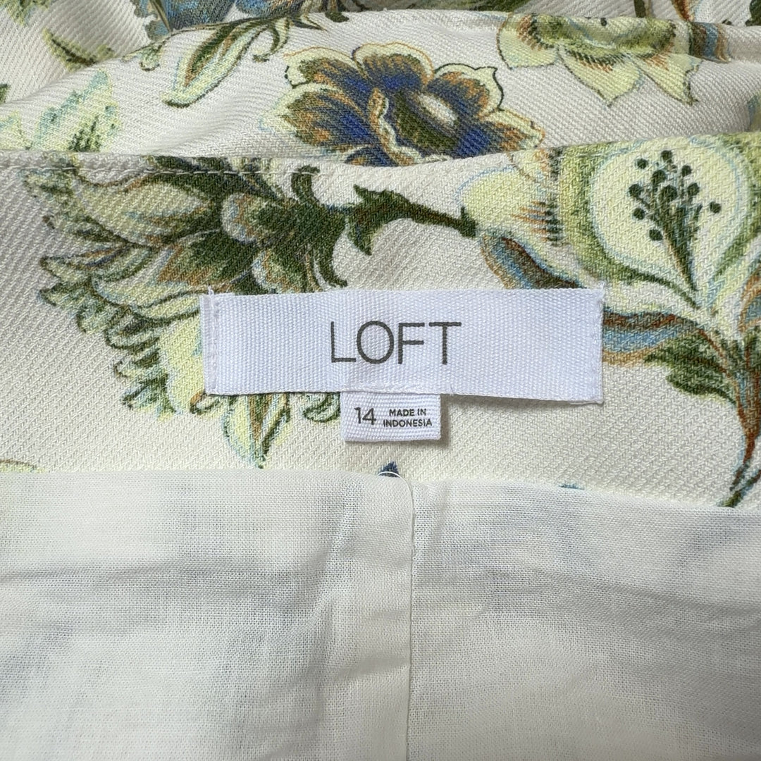 Tag view of cream floral print LOFT shorts showing A-line silhouette and botanical floral pattern