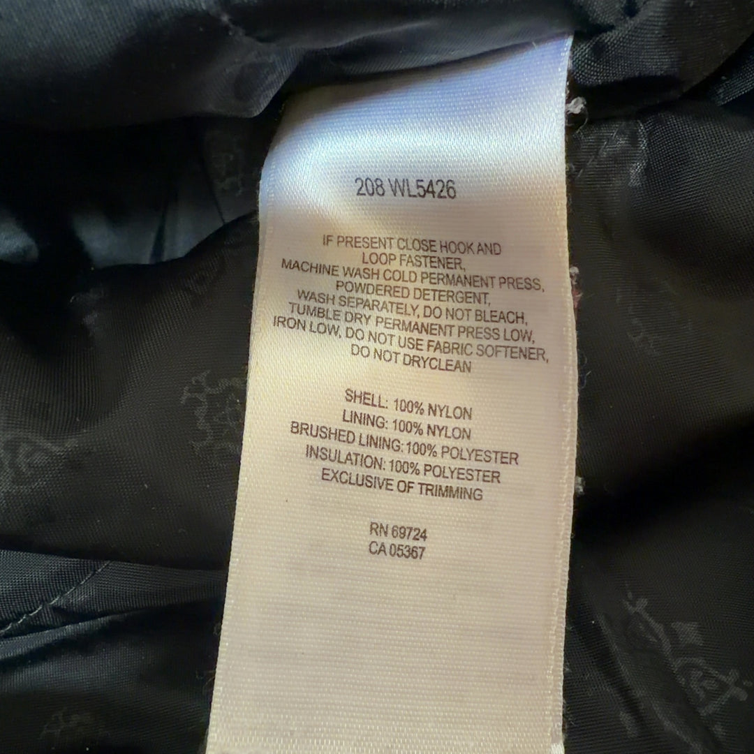 Black Columbia windbreaker jacket with white stripe details, back view showing hooded design and relaxed fit
