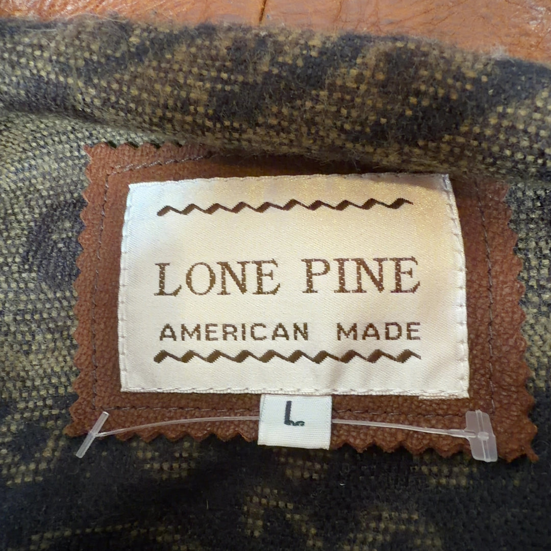 Cognac genuine leather zip-up jacket by LONE PINE, back view showing classic cut and fit
