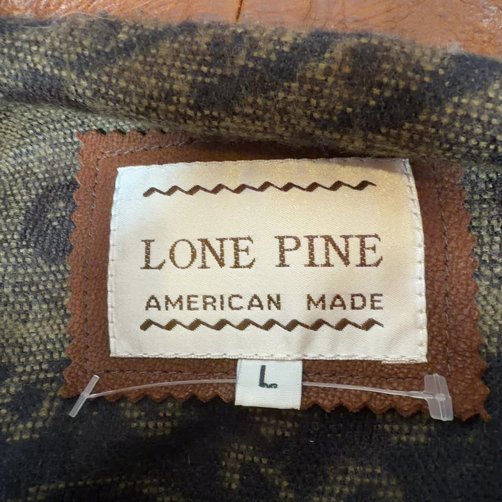 Cognac genuine leather zip-up jacket by LONE PINE, back view showing classic cut and fit