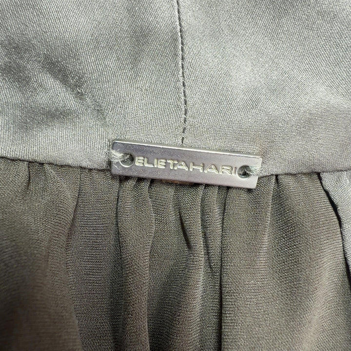 Gray silk halter tank top with tie-neck design, back view showing draping