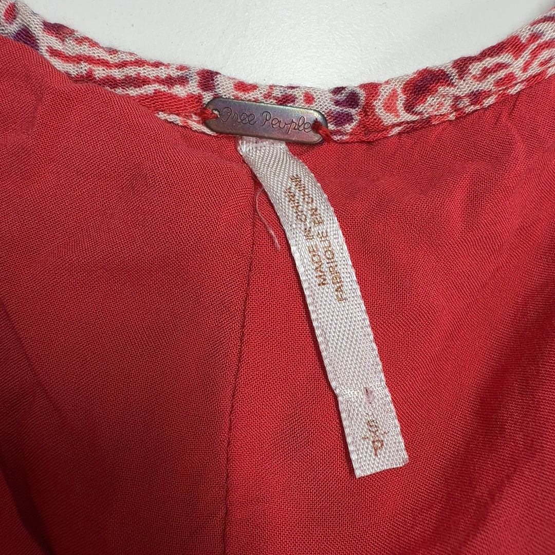 Red floral rayon tunic top with white print, back view showing flowing A-line silhouette