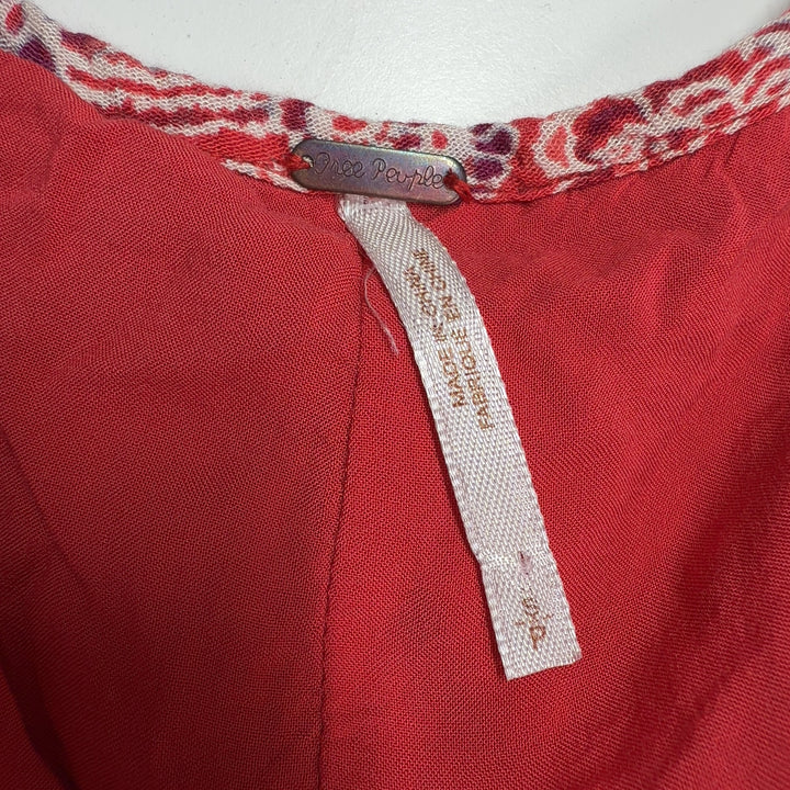 Red floral rayon tunic top with white print, back view showing flowing A-line silhouette