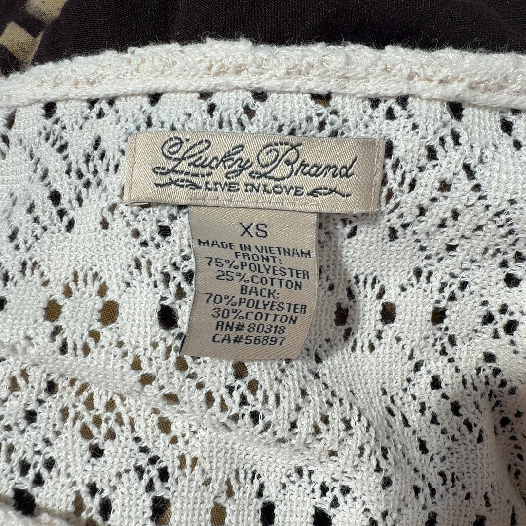 Cream lace short sleeve top back view showing lace detailing and relaxed fit