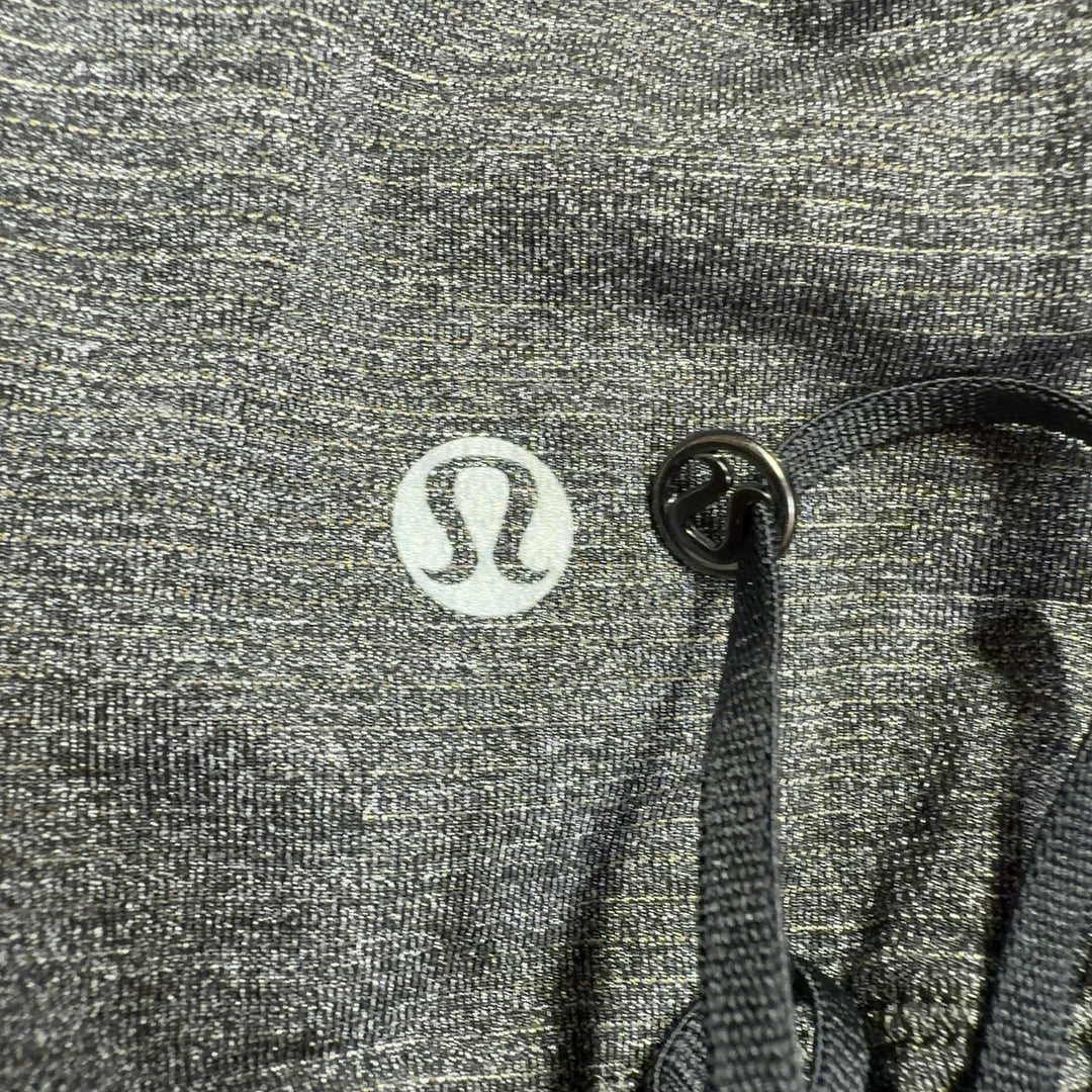 Tag view of gray Lululemon tank showing cutout detail and relaxed fit silhouette