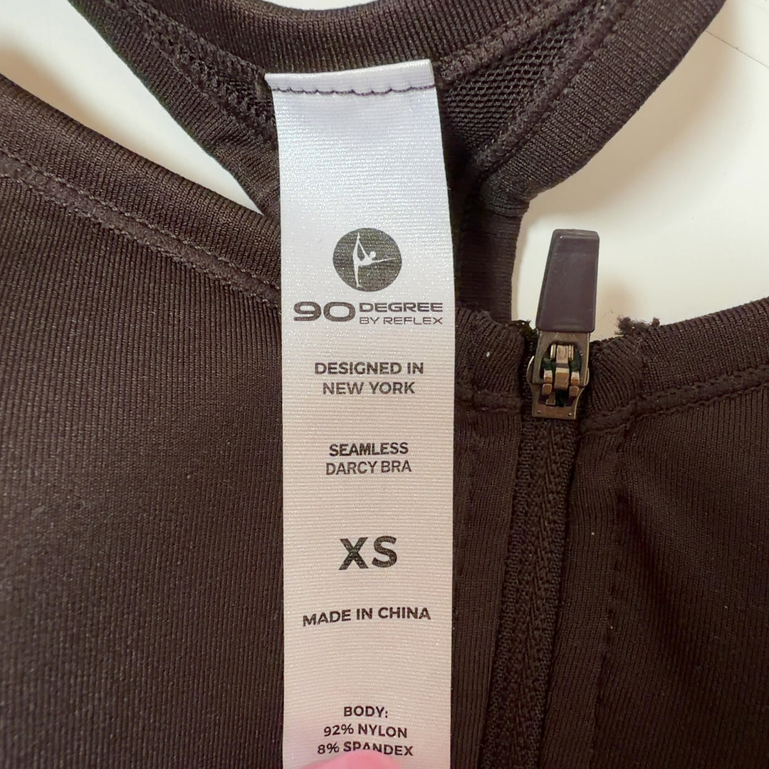 Black sports bra with front zip closure, back view showing strap design and fit