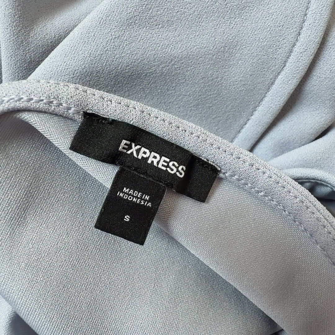 Gray cap sleeve shift dress back view showing functional side pocket and relaxed fit