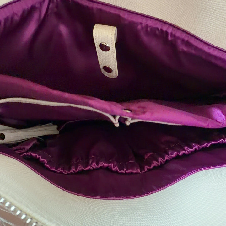 WHITE ELM cream leather tote bag worn on shoulder, back view showing structured silhouette