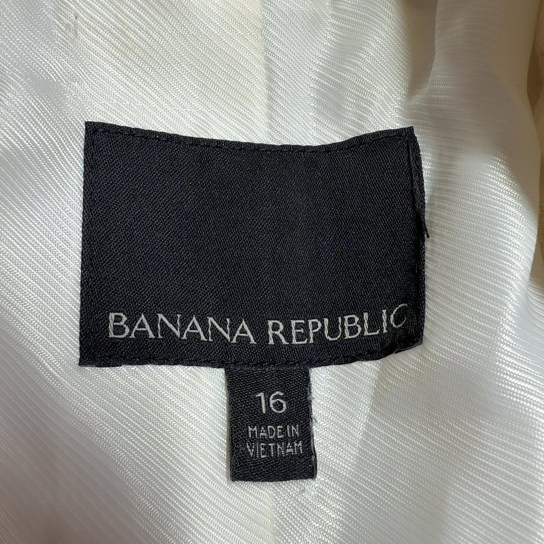 Cream double-breasted blazer with frayed edges, back view