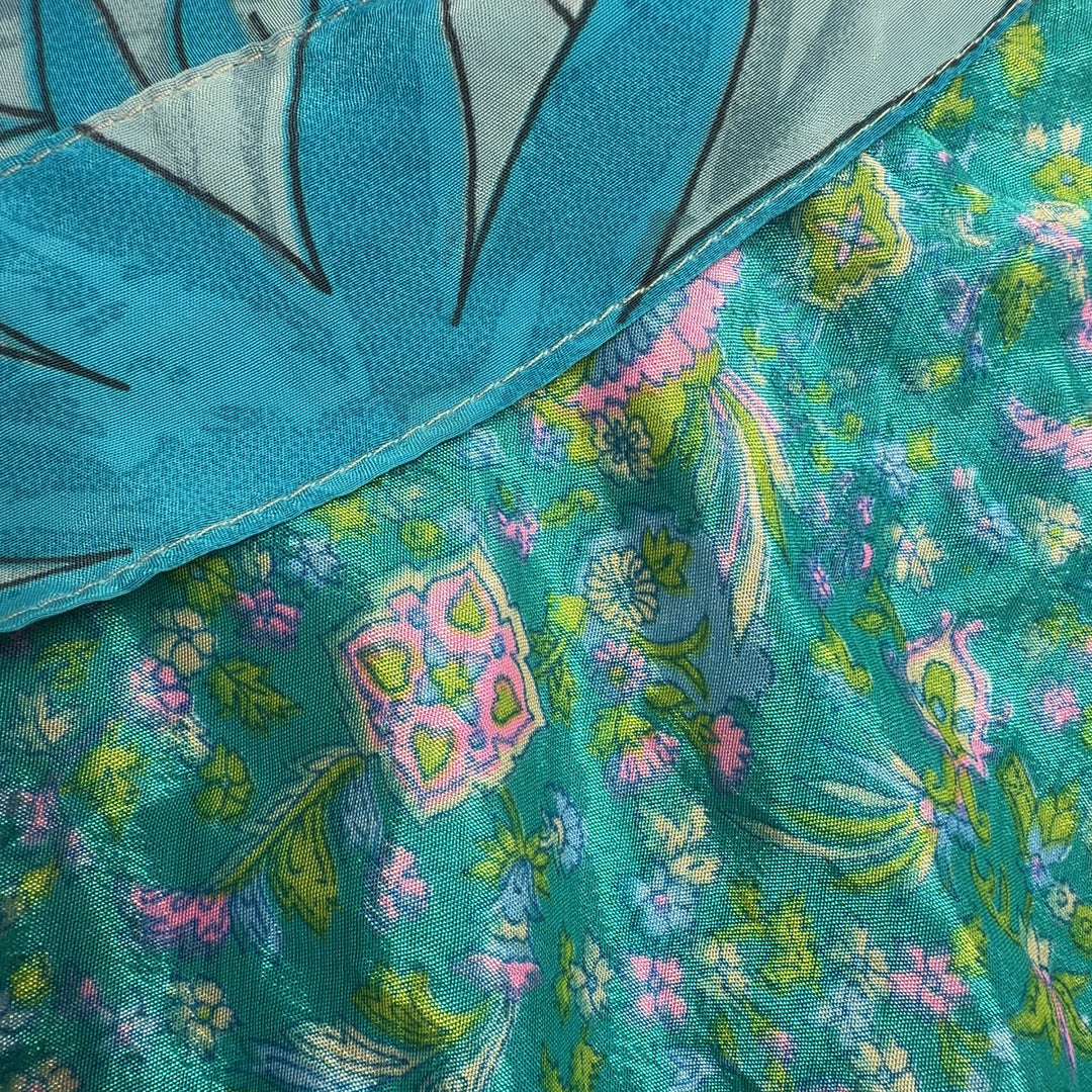 Turquoise floral wrap maxi skirt with layered floral pattern, back view showing flowing silhouette