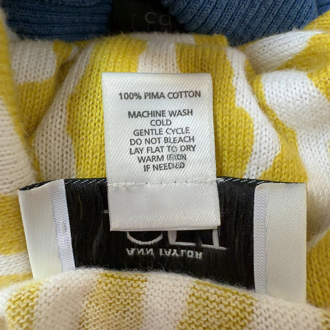 Tag view of yellow zebra print cardigan showing geometric stripe pattern and relaxed fit silhouette