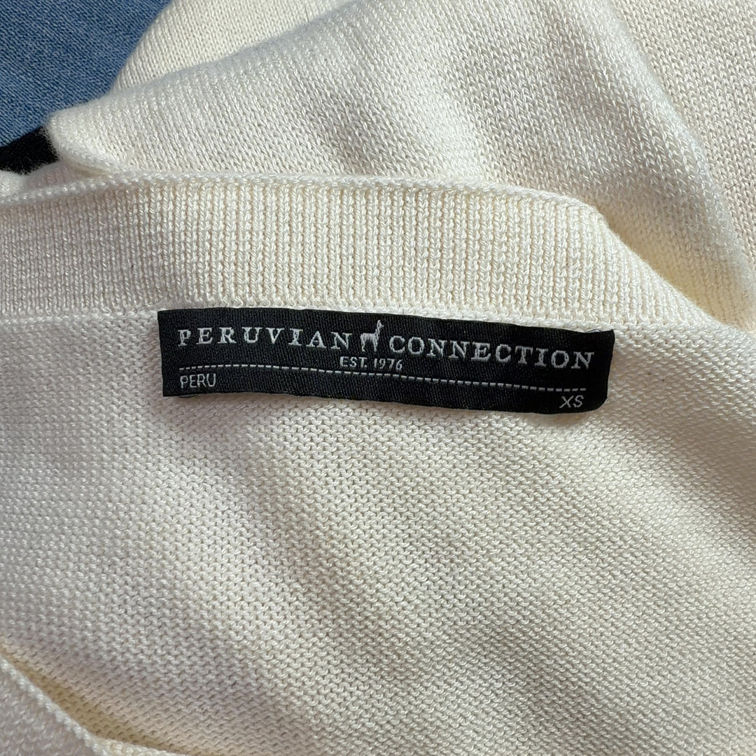 Cream modal pima cotton long sleeve knit, back view showing elongated tunic length