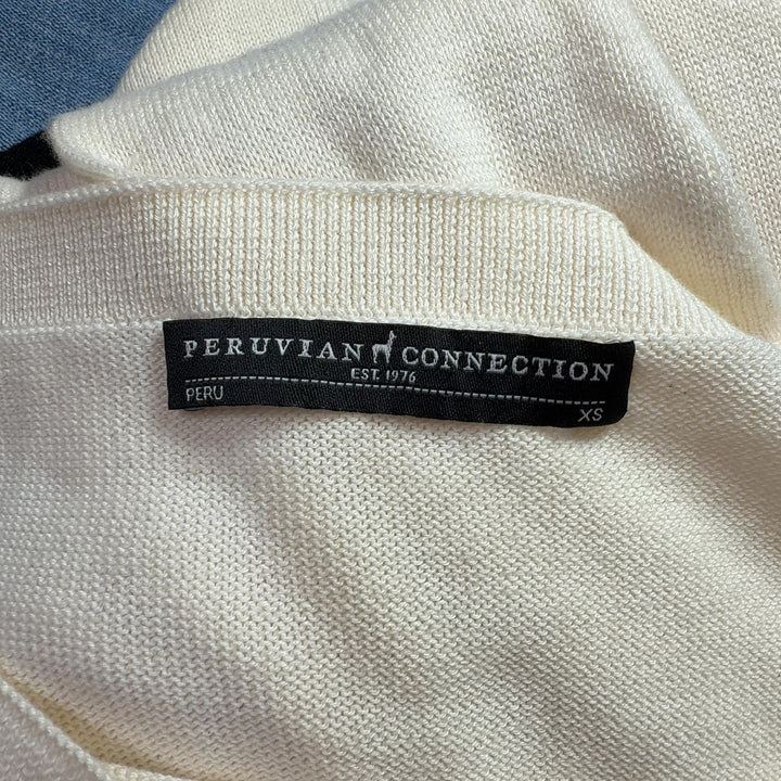 Cream modal pima cotton long sleeve knit, back view showing elongated tunic length