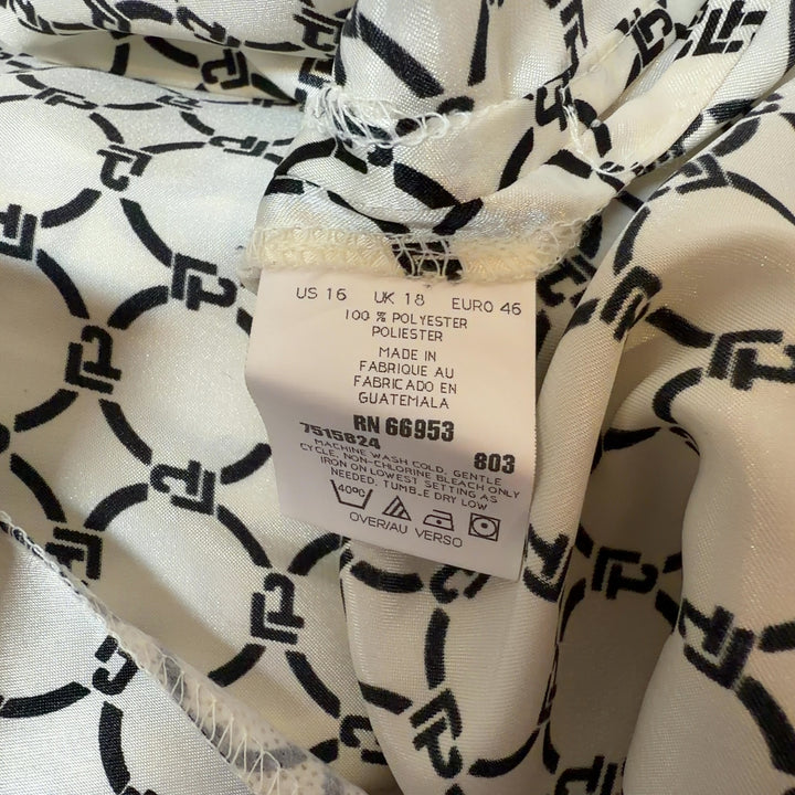 Cream geometric print button-up blouse with black pattern, back view on model