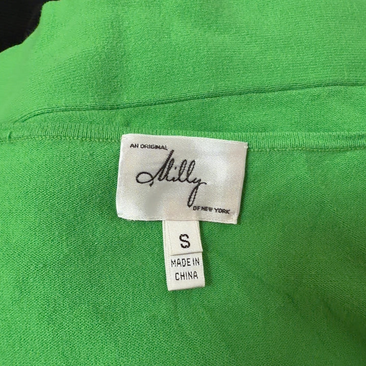 Green viscose knit top with ruffle detail, back view showing fitted silhouette
