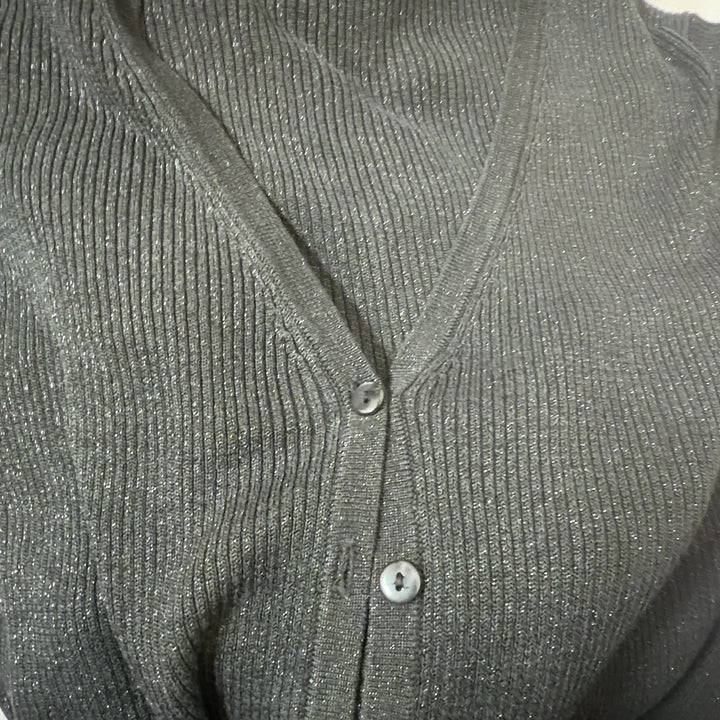 Tag view of charcoal silk lurex cardigan showing cropped silhouette and ribbed cuffs